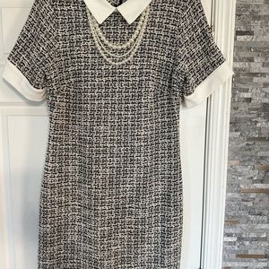 Tweed dress with pearls.